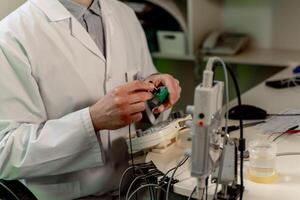 Electromyography equipment. Medical examination. EMG. Selective focus on doctor s hands. photo