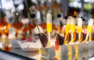 Finger food. Table with snacks and appetizers. Event party. Blurred background. photo