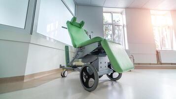 Wheel chair in hospital corridor. Modern wheelchair. Health and surgery concept. photo