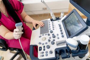 Ultrasound machine, ultrasonography. Medical equipment, healthcare concept. Selective focus photo