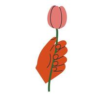 Hand drawn cute cartoon illustration of hand with tulip. Flat vector arm holds the spring flower sticker in colored doodle style. Blooming plant, botany icon or print. Isolated on background.