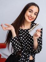 Color teeth pallete for whitening in dental clinic. Girl on blurred background. Close up. photo