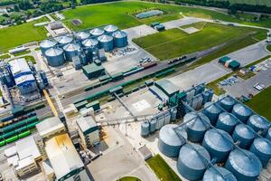 Production of sustainable fuel called bio gas. New factory in field. View from above. Ecological production. photo