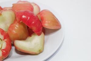 Rose apple isolated, Syzygium aqueum or watery rose apple, water apple, bell fruit, jambu air, fruits on the tree. photo