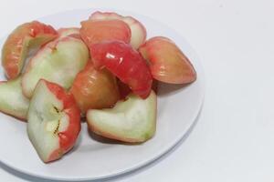 Rose apple isolated, Syzygium aqueum or watery rose apple, water apple, bell fruit, jambu air, fruits on the tree. photo