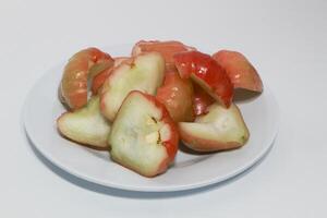 Rose apple isolated, Syzygium aqueum or watery rose apple, water apple, bell fruit, jambu air, fruits on the tree. photo