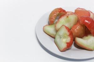 Rose apple isolated, Syzygium aqueum or watery rose apple, water apple, bell fruit, jambu air, fruits on the tree. photo