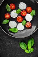 mozzarella salad caprese tomato, basil fresh food tasty eating appetizer meal food snack photo