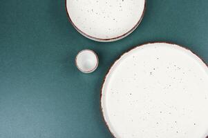 Empty round ceramic plate set. photo