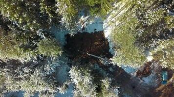 Aerial top view of work on a construction site during winter. Clip. Workers and equipment for works with cold ground. video