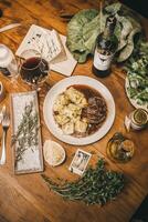a table with food and wine on it photo