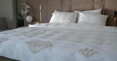 Bedroom filled with soft natural light from the big glass door to the balcony video