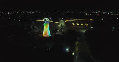 A drone flies over a glowing Shukhov Tower in the city. video