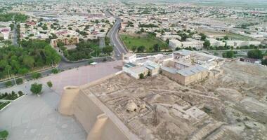 Drone flight along the old ancient walls of the Ark fortress in Bukhara video