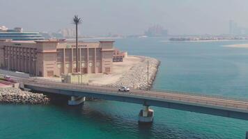 A drone flies over a road bridge over the sea in the United Arab Emirates video