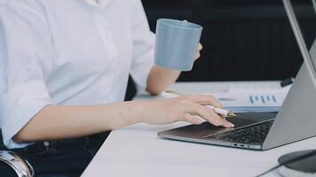 Business woman using calculator for do math finance on wooden desk in office and business working background, tax, accounting, statistics and analytic research concept video