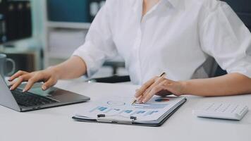 Business woman using calculator for do math finance on wooden desk in office and business working background, tax, accounting, statistics and analytic research concept video