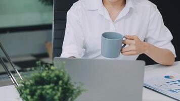 Business woman using calculator for do math finance on wooden desk in office and business working background, tax, accounting, statistics and analytic research concept video