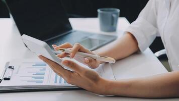 Business woman using calculator for do math finance on wooden desk in office and business working background, tax, accounting, statistics and analytic research concept video
