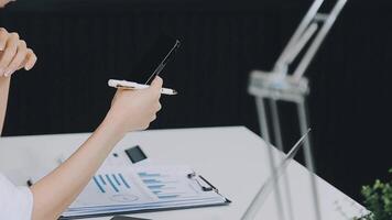 Business woman using calculator for do math finance on wooden desk in office and business working background, tax, accounting, statistics and analytic research concept video