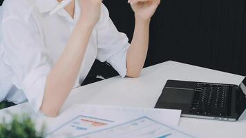 Business woman using calculator for do math finance on wooden desk in office and business working background, tax, accounting, statistics and analytic research concept video