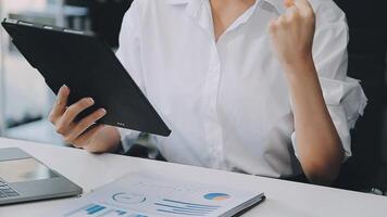 Business woman using calculator for do math finance on wooden desk in office and business working background, tax, accounting, statistics and analytic research concept video