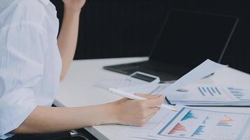 Business woman using calculator for do math finance on wooden desk in office and business working background, tax, accounting, statistics and analytic research concept video
