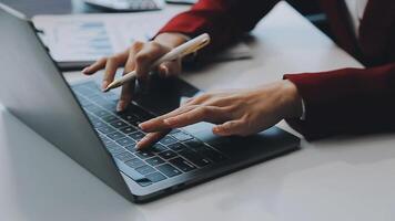 Business woman using calculator for do math finance on wooden desk in office and business working background, tax, accounting, statistics and analytic research concept video
