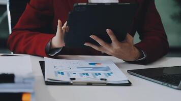 Business woman using calculator for do math finance on wooden desk in office and business working background, tax, accounting, statistics and analytic research concept video