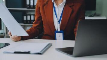 Business woman using calculator for do math finance on wooden desk in office and business working background, tax, accounting, statistics and analytic research concept video