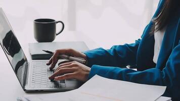 Young woman ecommerce busines worker drinking coffee at office video