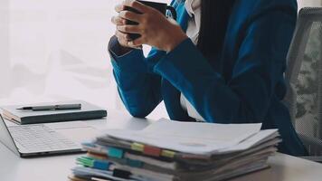 Young woman ecommerce busines worker drinking coffee at office video