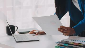 Business woman using calculator for do math finance on wooden desk in office and business working background, tax, accounting, statistics and analytic research concept video