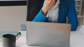 Business woman using calculator for do math finance on wooden desk in office and business working background, tax, accounting, statistics and analytic research concept video