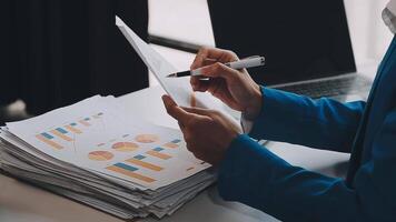 Business woman using calculator for do math finance on wooden desk in office and business working background, tax, accounting, statistics and analytic research concept video