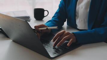 Business woman using calculator for do math finance on wooden desk in office and business working background, tax, accounting, statistics and analytic research concept video
