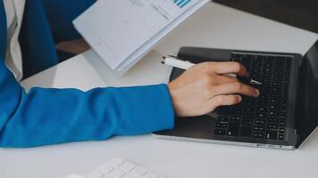 Business woman using calculator for do math finance on wooden desk in office and business working background, tax, accounting, statistics and analytic research concept video