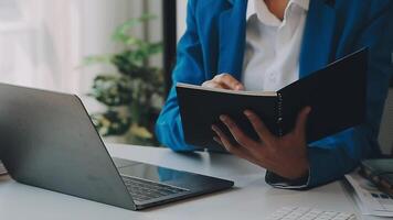 Business woman using calculator for do math finance on wooden desk in office and business working background, tax, accounting, statistics and analytic research concept video