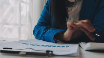 Business woman using calculator for do math finance on wooden desk in office and business working background, tax, accounting, statistics and analytic research concept video