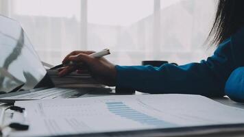 Business woman using calculator for do math finance on wooden desk in office and business working background, tax, accounting, statistics and analytic research concept video