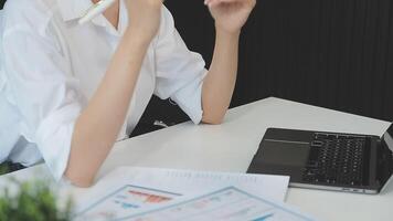 Business woman using calculator for do math finance on wooden desk in office and business working background, tax, accounting, statistics and analytic research concept video
