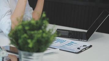 Business woman using calculator for do math finance on wooden desk in office and business working background, tax, accounting, statistics and analytic research concept video