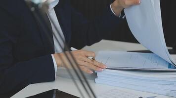 Business woman using calculator for do math finance on wooden desk in office and business working background, tax, accounting, statistics and analytic research concept video