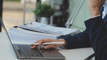 Business woman using calculator for do math finance on wooden desk in office and business working background, tax, accounting, statistics and analytic research concept video