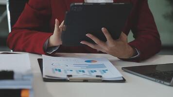 Business woman using calculator for do math finance on wooden desk in office and business working background, tax, accounting, statistics and analytic research concept video