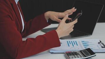 Business woman using calculator for do math finance on wooden desk in office and business working background, tax, accounting, statistics and analytic research concept video