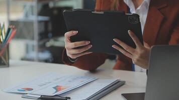 Business woman using calculator for do math finance on wooden desk in office and business working background, tax, accounting, statistics and analytic research concept video