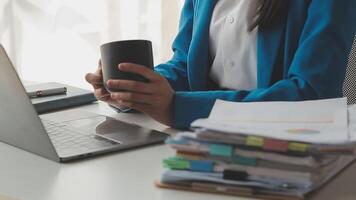 Young woman ecommerce busines worker drinking coffee at office video