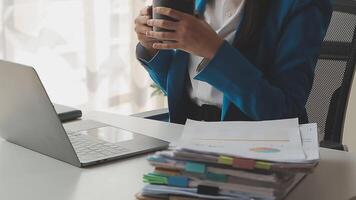 Young woman ecommerce busines worker drinking coffee at office video