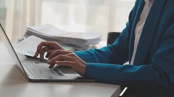 Business woman using calculator for do math finance on wooden desk in office and business working background, tax, accounting, statistics and analytic research concept video
